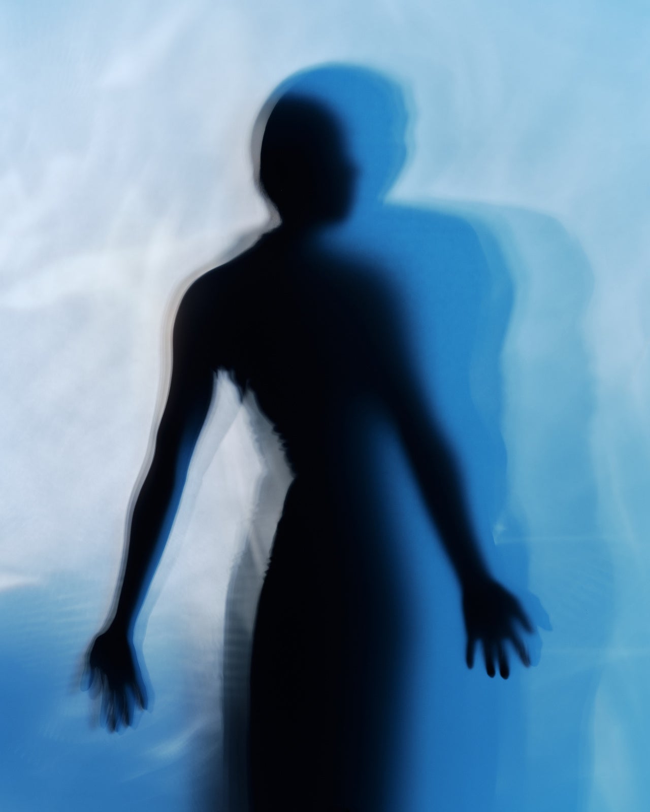 woman silhouette through frosted glass, botanical bath ritual for perimenopause