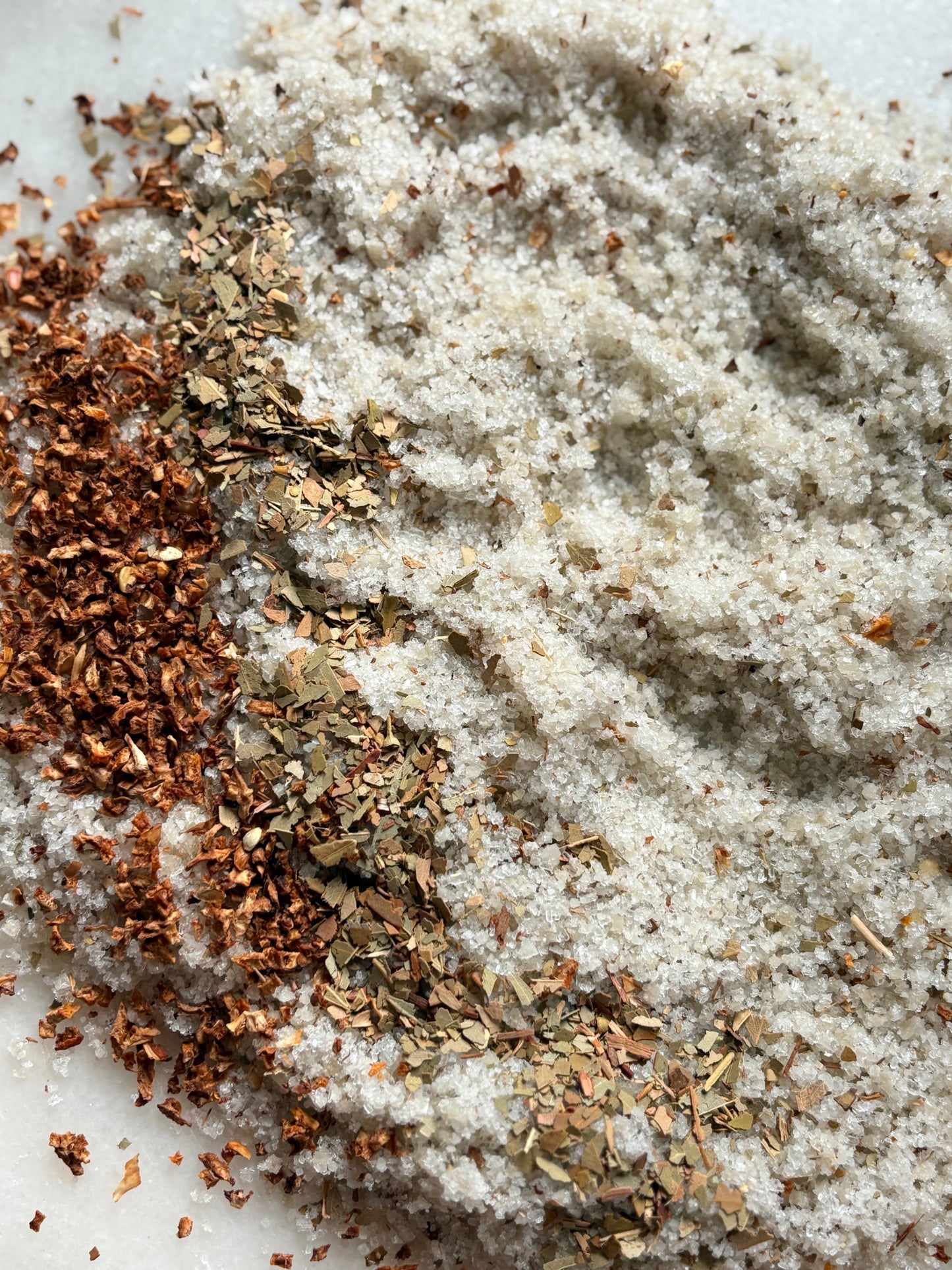 Niteswim Open Road Blend shows a Close-up of salt with dried lemon peel and eucalyptus on a white surface