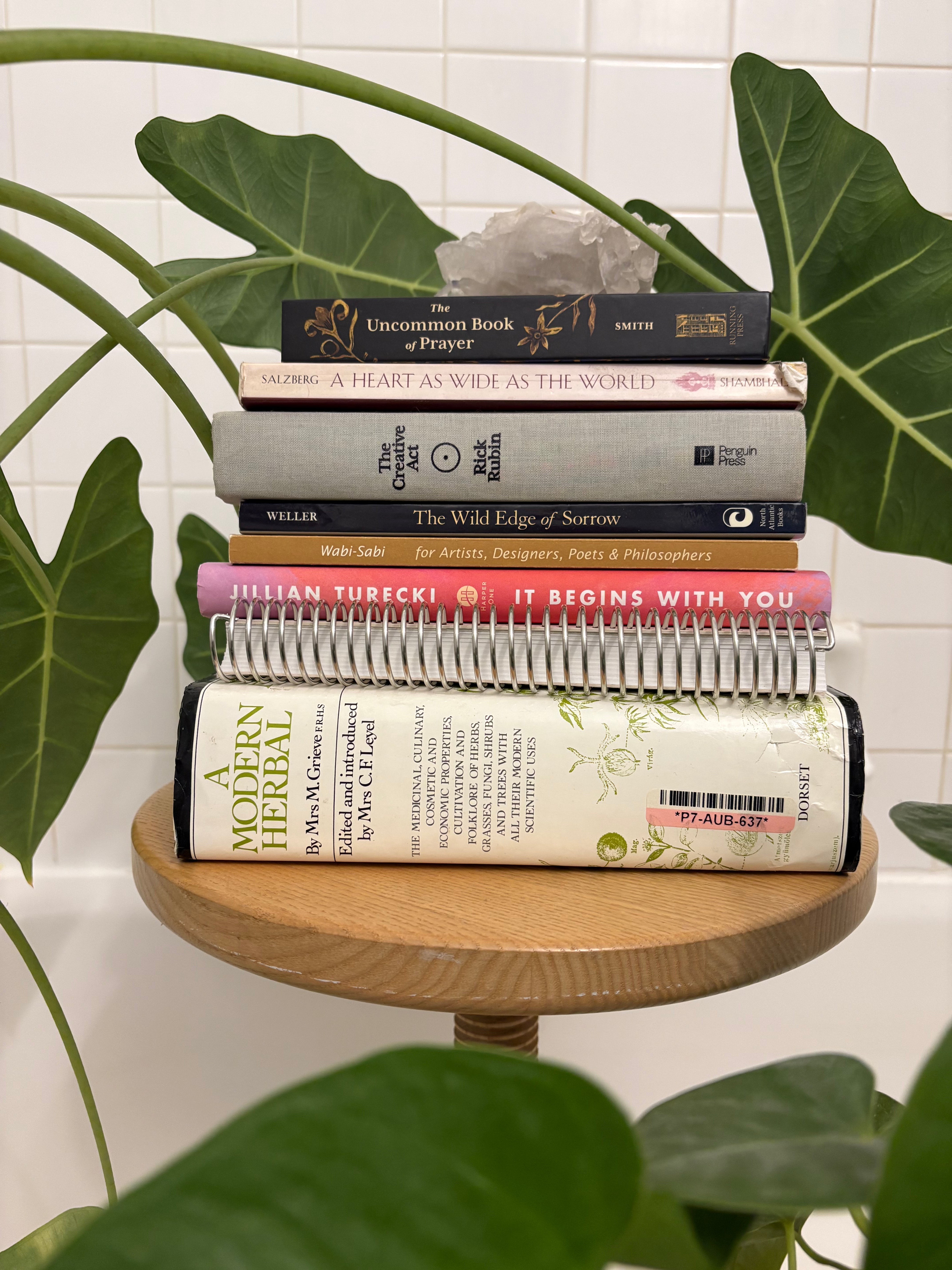 Books stacked on a wooden stool