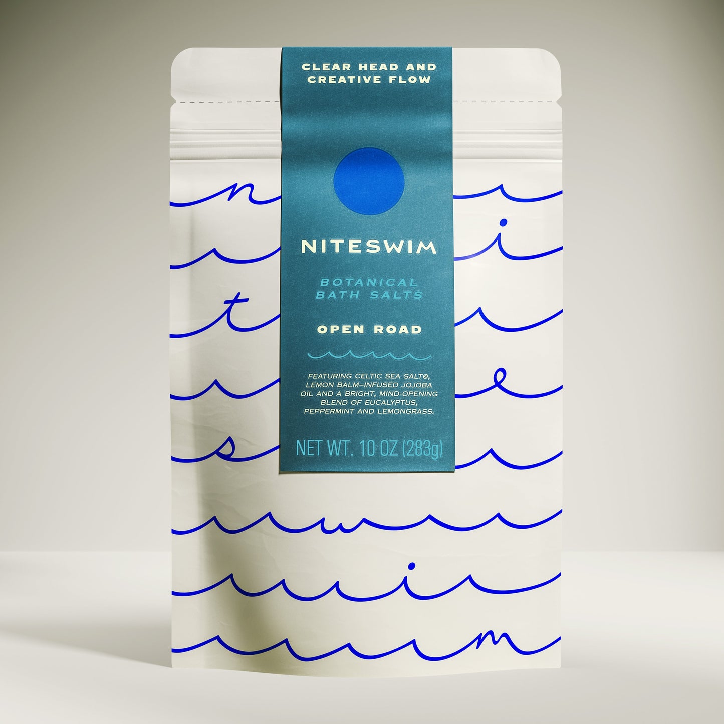 Niteswim botanical bath salts packaging with wavy line design on a neutral background. Open Road bath blend for creativity and manifestation support.